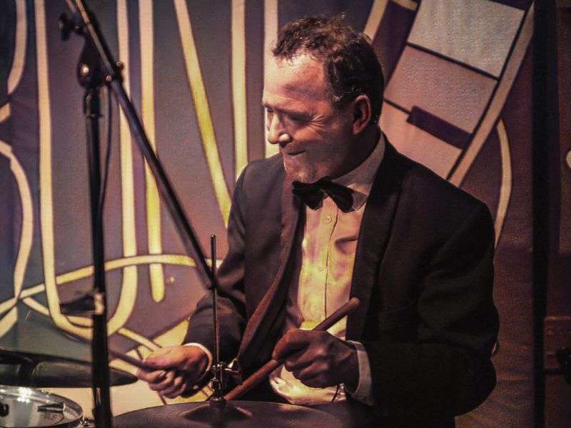 A photo of drummer John Rae.